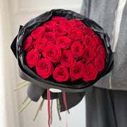 Red rose bouquet in black wrapping